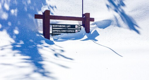 Heavenly ski resort trail sign buried in snow