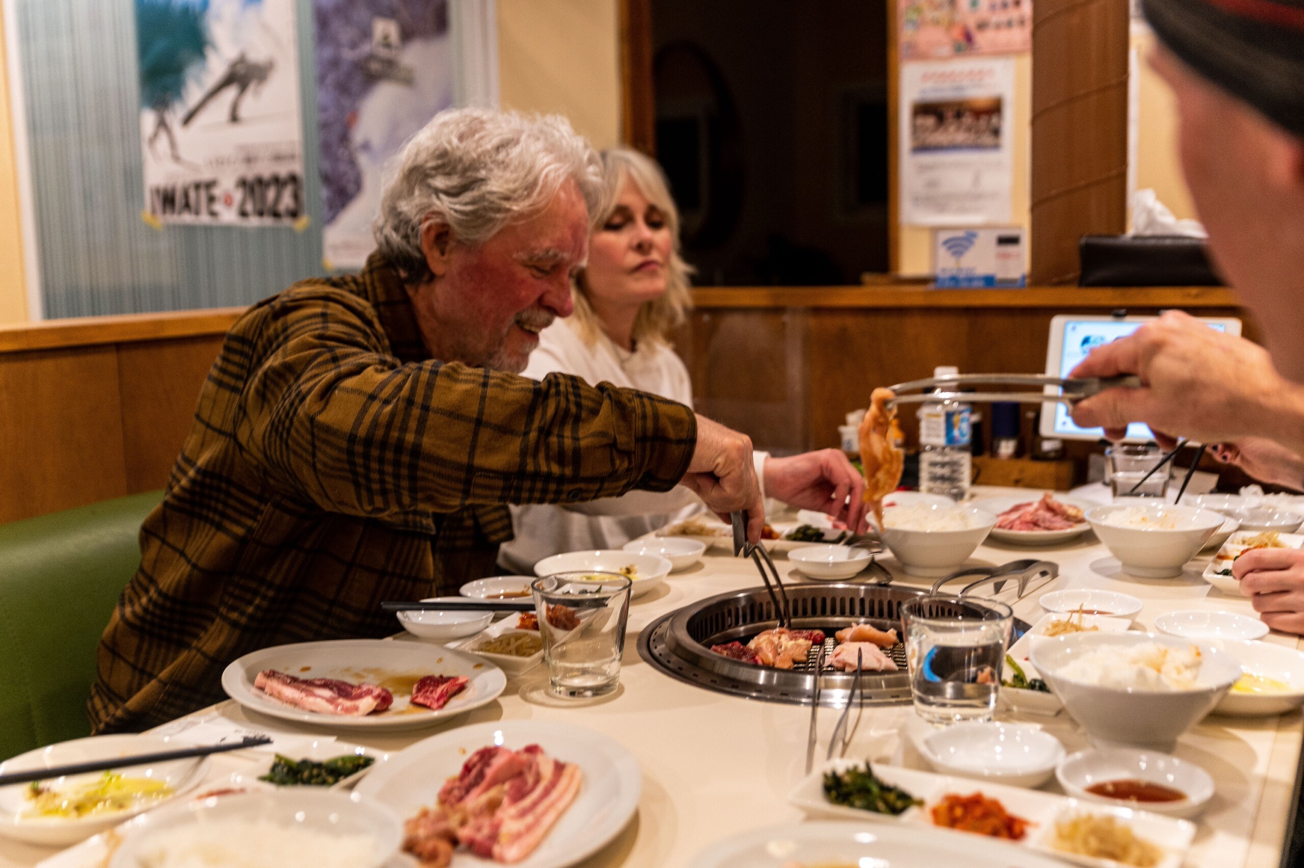 Owner of Indy Pass enjoying grilled meats at a restaurant in Japan