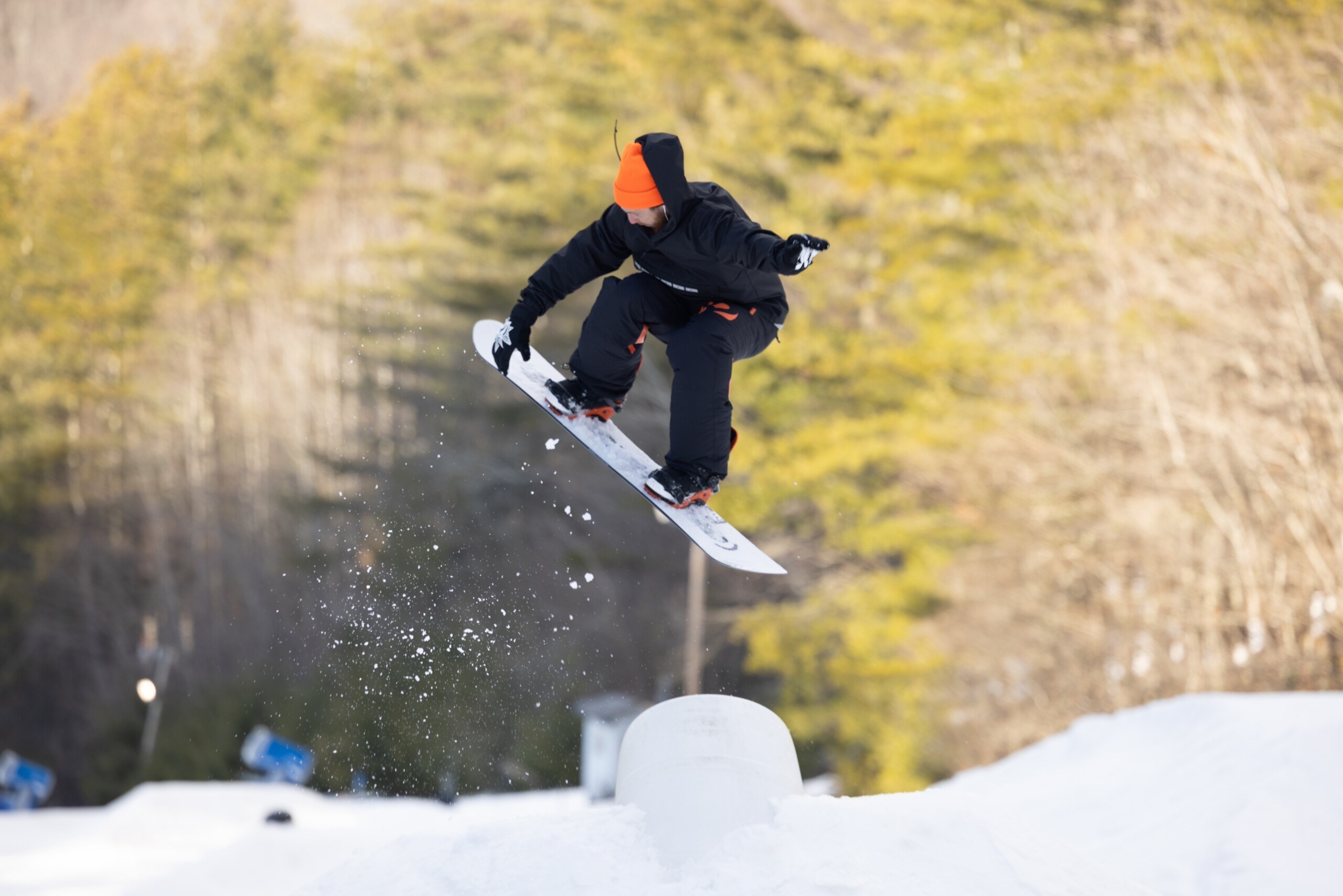 Snowboarder pulling a trick in the terrain park at Hatley Pointe in North Carolina