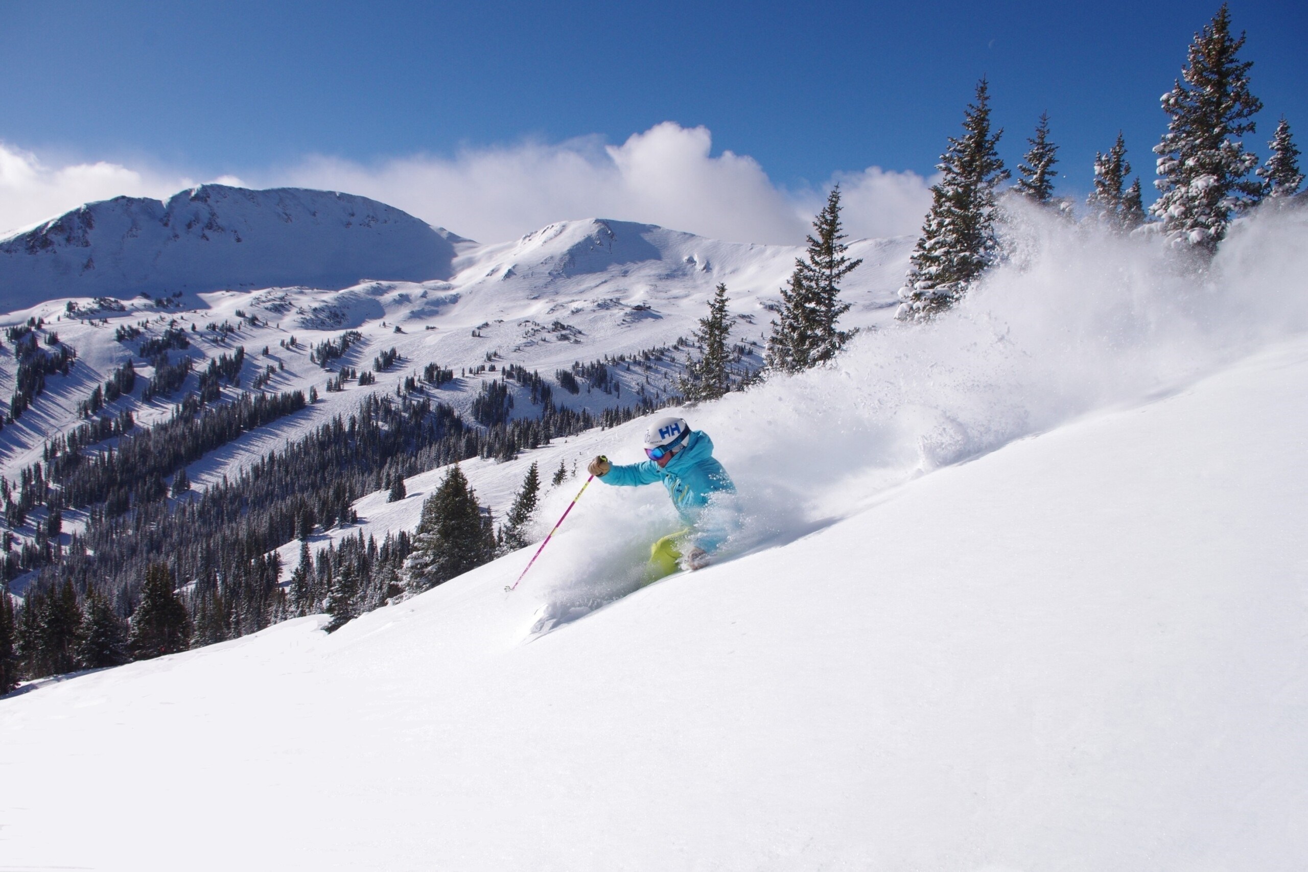 skier enjoying waist deep powder at Loveland Ski Area in Colorado