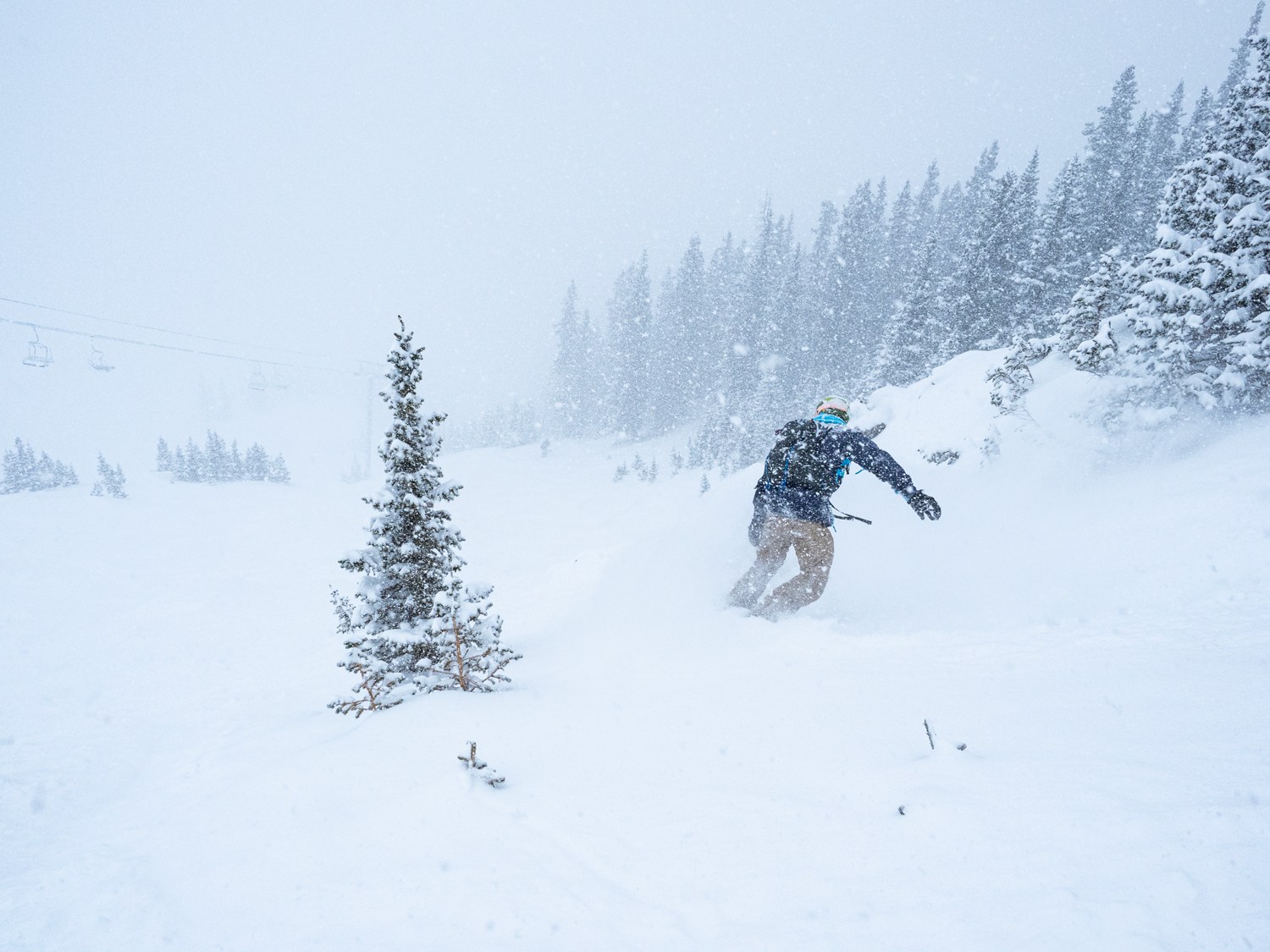 snowboarder enjoying powder at Powder Mountain Resort in Utah wearing the Burton ak Cyclic Pants