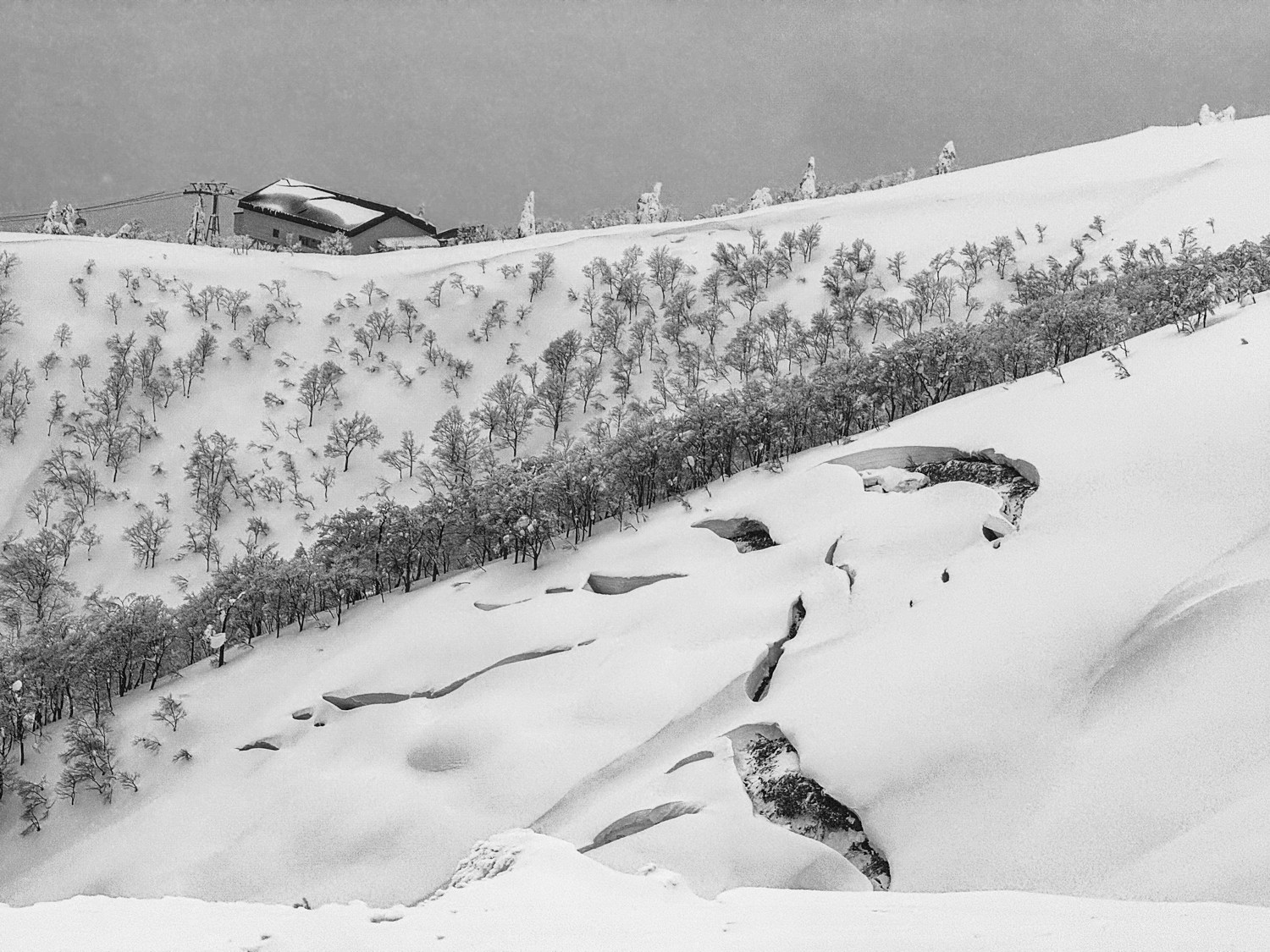 Glide avalanches at Ani Ski Resort with gondola station in the background