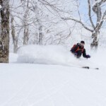 Skier enjoying powder at Ani Ski Resort