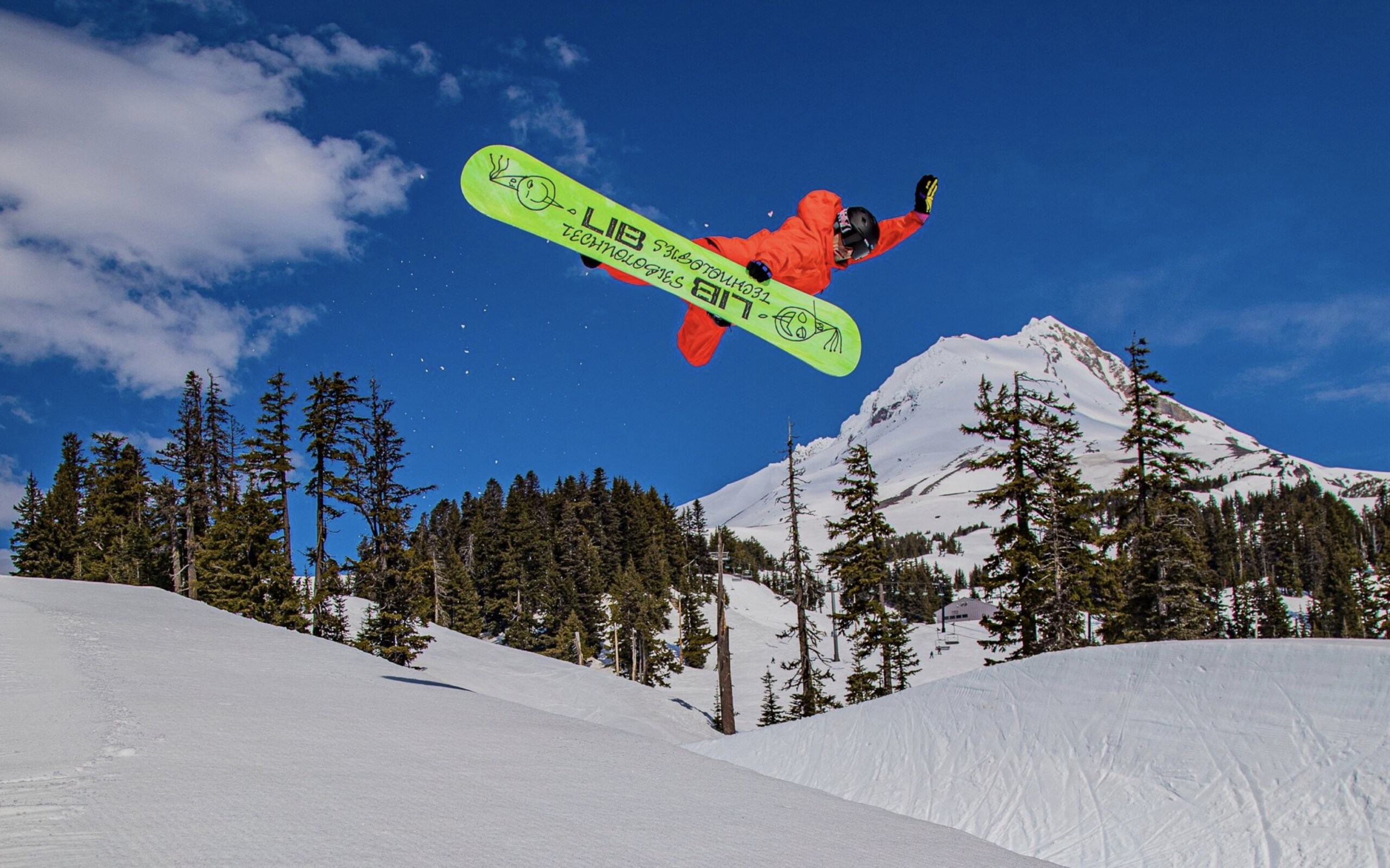 snowboarder pulling a method in the half pipe at Mt Hood Meadows