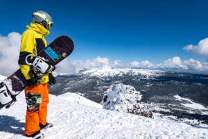 Skier looking over Mt Bachelor from the summit