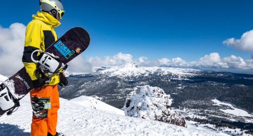Skier looking over Mt Bachelor from the summit