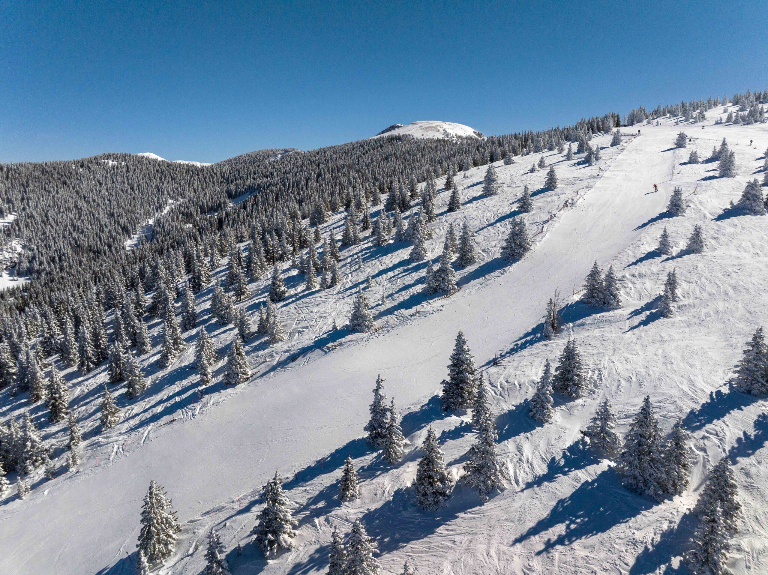 skiers descending down Gayway at Ski Santa Fe