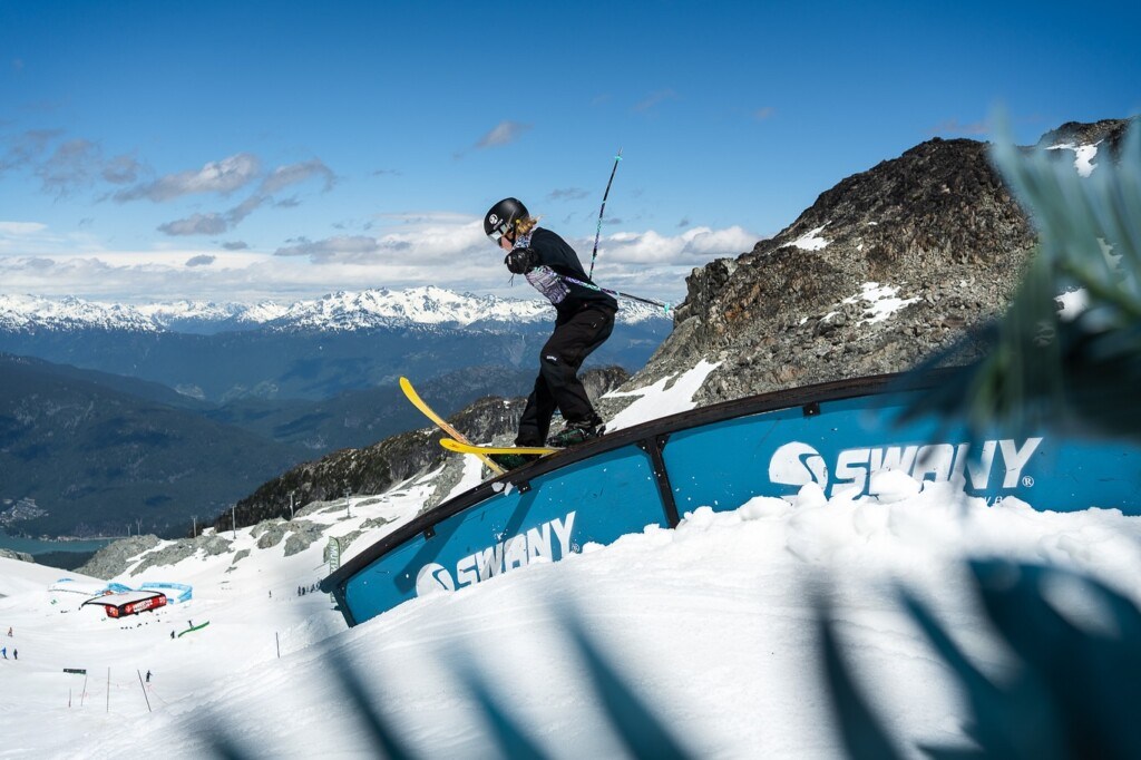 skier riding a rail at Momentum ski camps