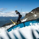 skier riding a rail at Momentum ski camps