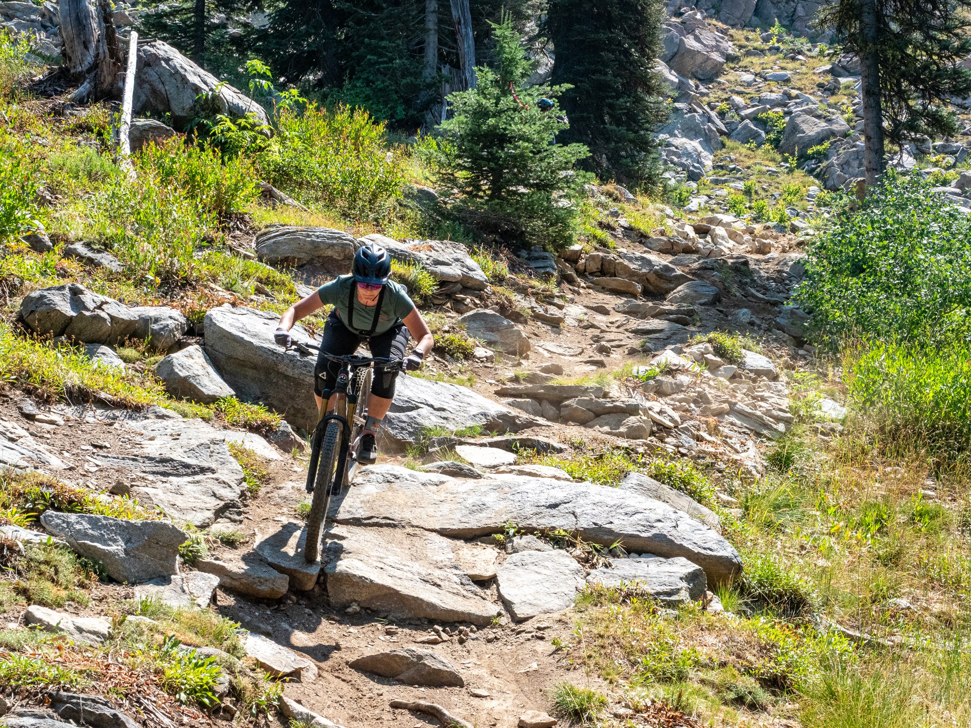 mountain biker diving down Brundage's rowdy Hidden Valley trail