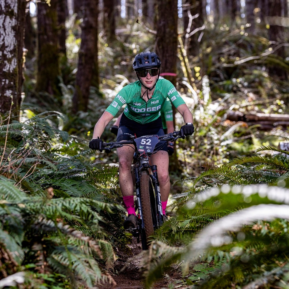 mountain biker covered in mud at the Mudslinger Classic