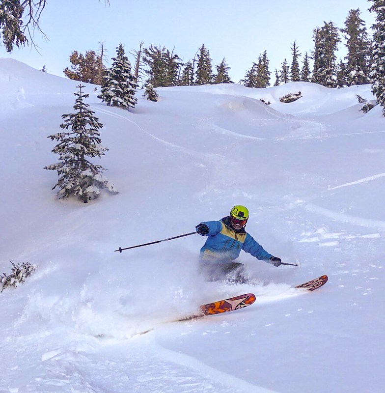 Skier skiing powder in a chute at Kirkwood Mountain Resort