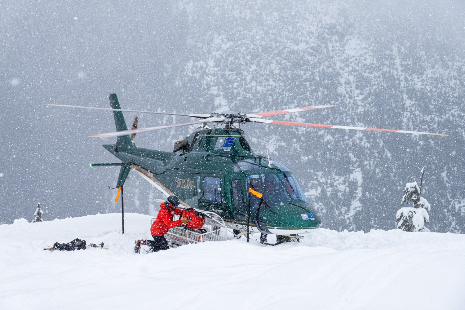 helicopter loading up skiers to go to their next ski run