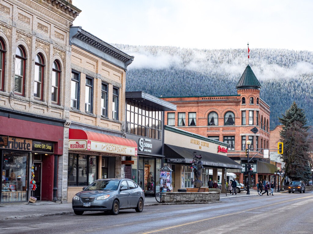 The town of Nelson on the Powder Highway with a coat of snow on the mountains above town