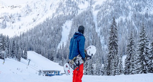 Snowboarder looking at the steep terrain at Whitewater Ski Resort