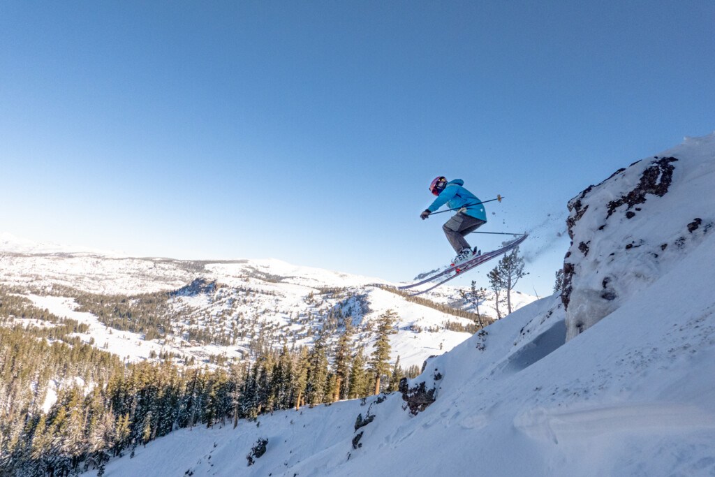 skier leaping off cliff at Kirkwood Ski Resort