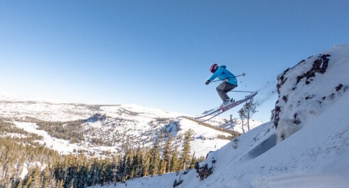 skier leaping off cliff at Kirkwood Ski Resort