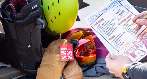person using ski & snowboard checklist to make sure they everything for their day snowboarding